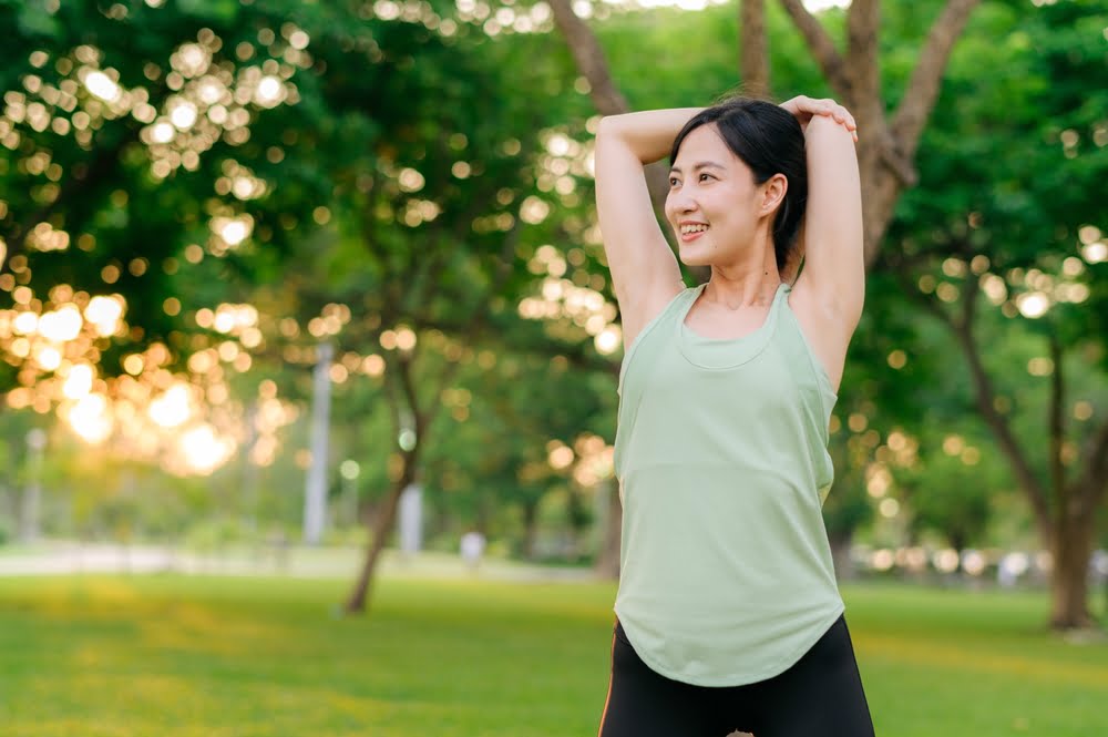 Woman stretching outdoors - Softwave TRT in Metairie, LA